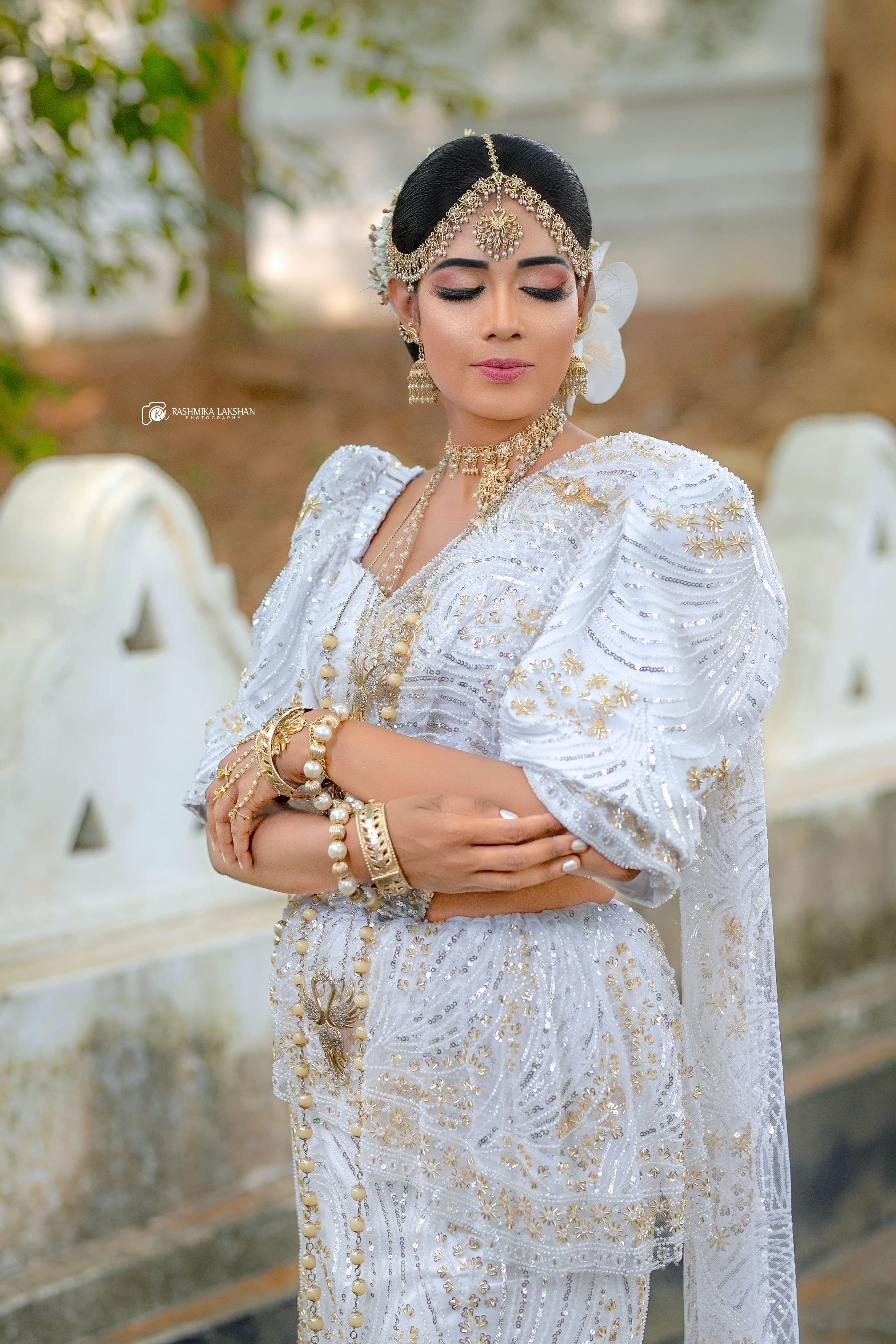 Bride wearing traditional wedding jewellery before the ceremony