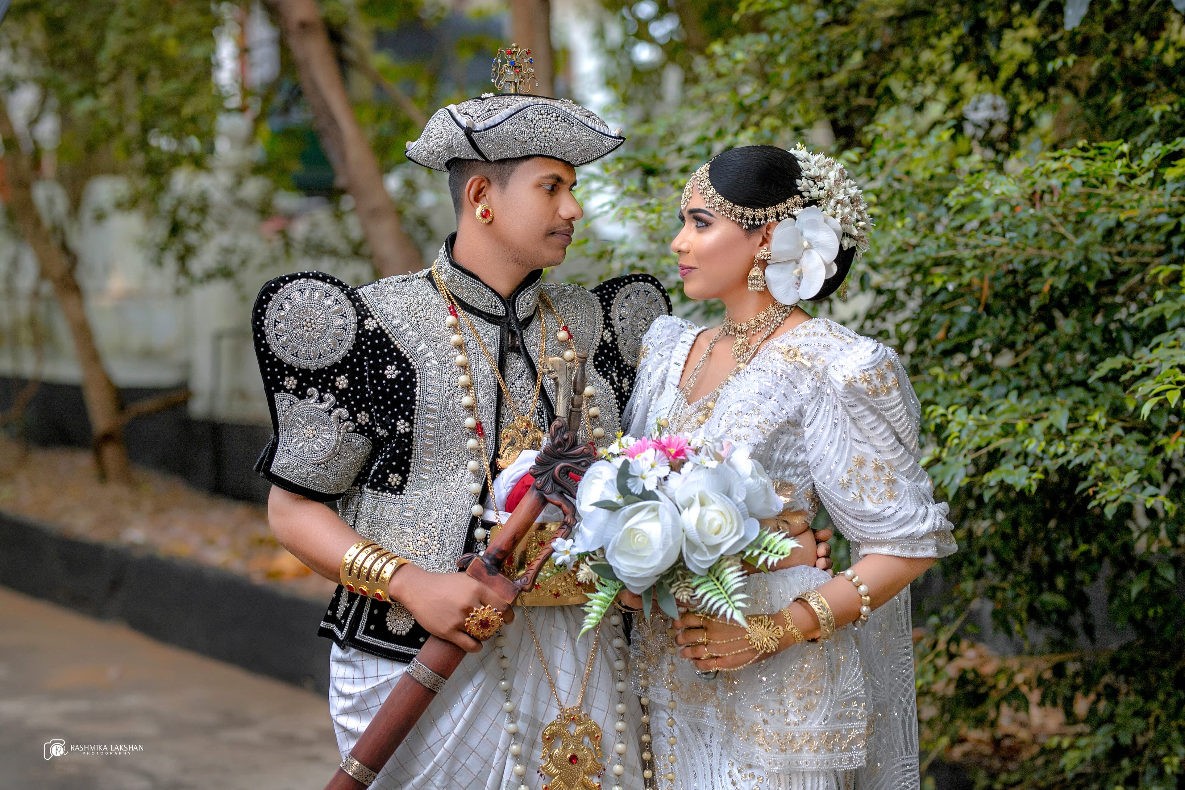 Wedding couple during a ceremony photographed in Ampara