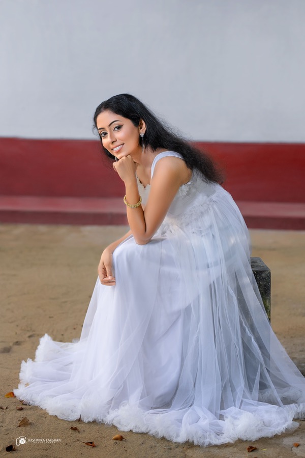 Seated in White, portrait photograph, 2025
